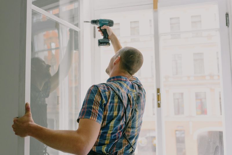 360 Powered Systems service professional installing a window frame